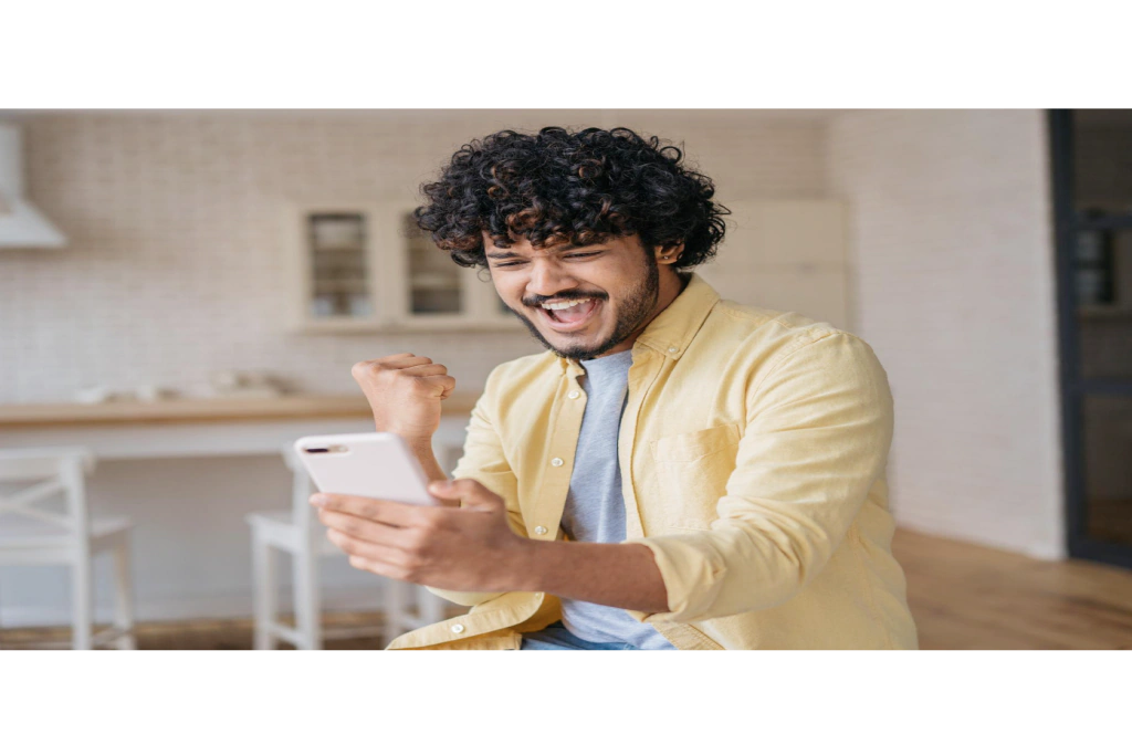 Customer celebrating a reward on his phone